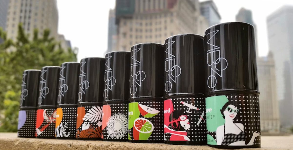 All 8 MBeze Deodorettes against the downtown Chicago cityscape on the Michigan Ave bridge.