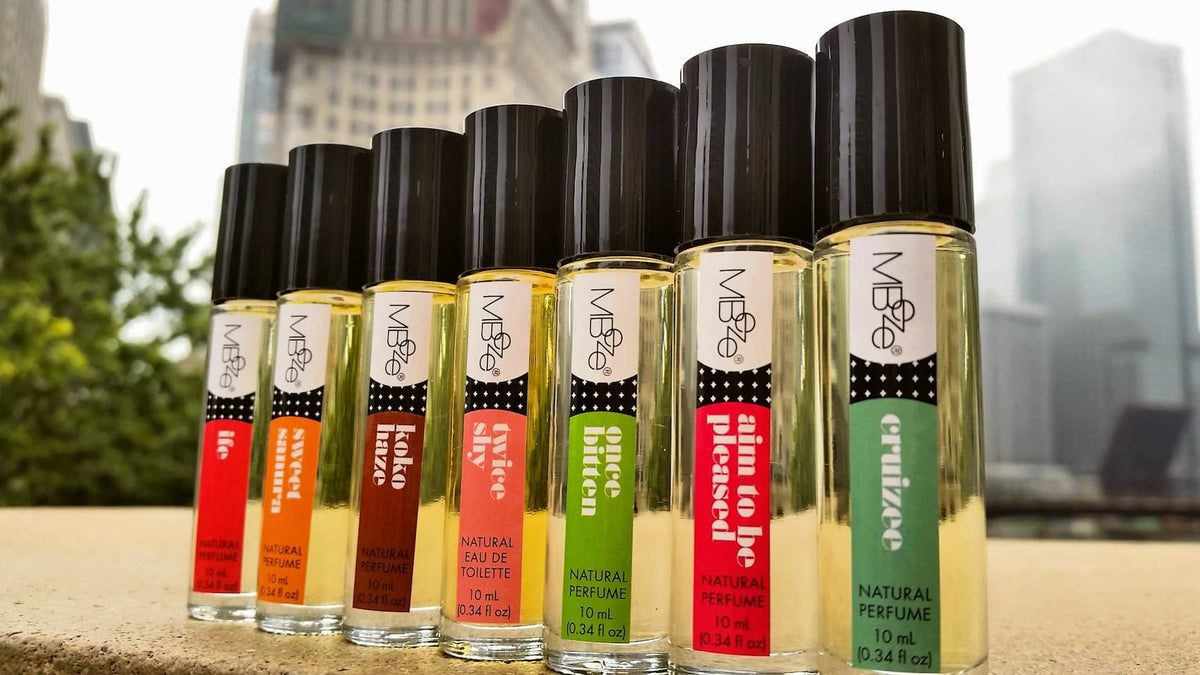 MBeze Roll-On Perfumes, a 7 scents, against Chicago River and cityscape on Michigan Ave Bridge.
