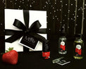 MBeze Ife Mini Gift Set with gift box, including Deodorette, Body Mist Traveler, Body Oil Traveler, and Perfume Sample, with large strawberry in front.