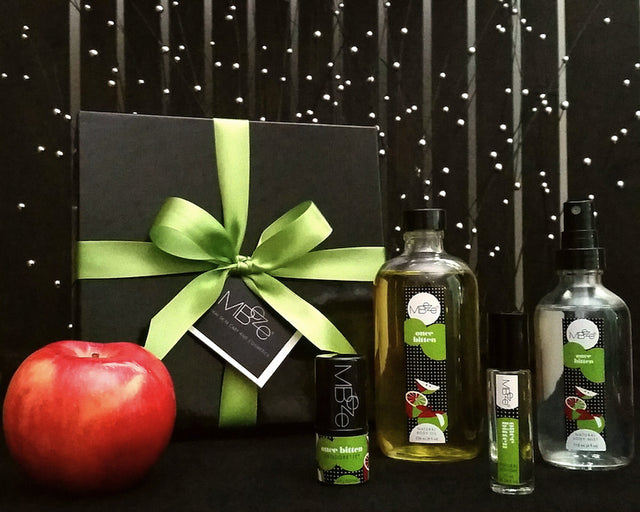 Once Bitten Deluxe Collection with gift box and apple. Including Deodorette, Body Oil, Perfume, and Body Mist.