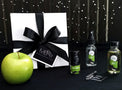 Once Bitten Mini Gift Set with gift box and green apple, including Deodorette, Body Mist Traveler, Body Oil Traveler, and Perfume Sample.